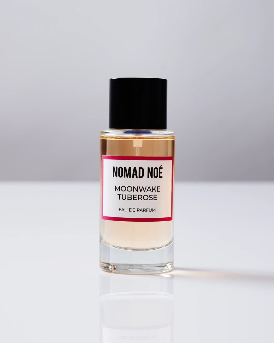 MOONWAKE TUBEROSE Eau de Parfum bottle by Nomad Noé with black cap on a white surface